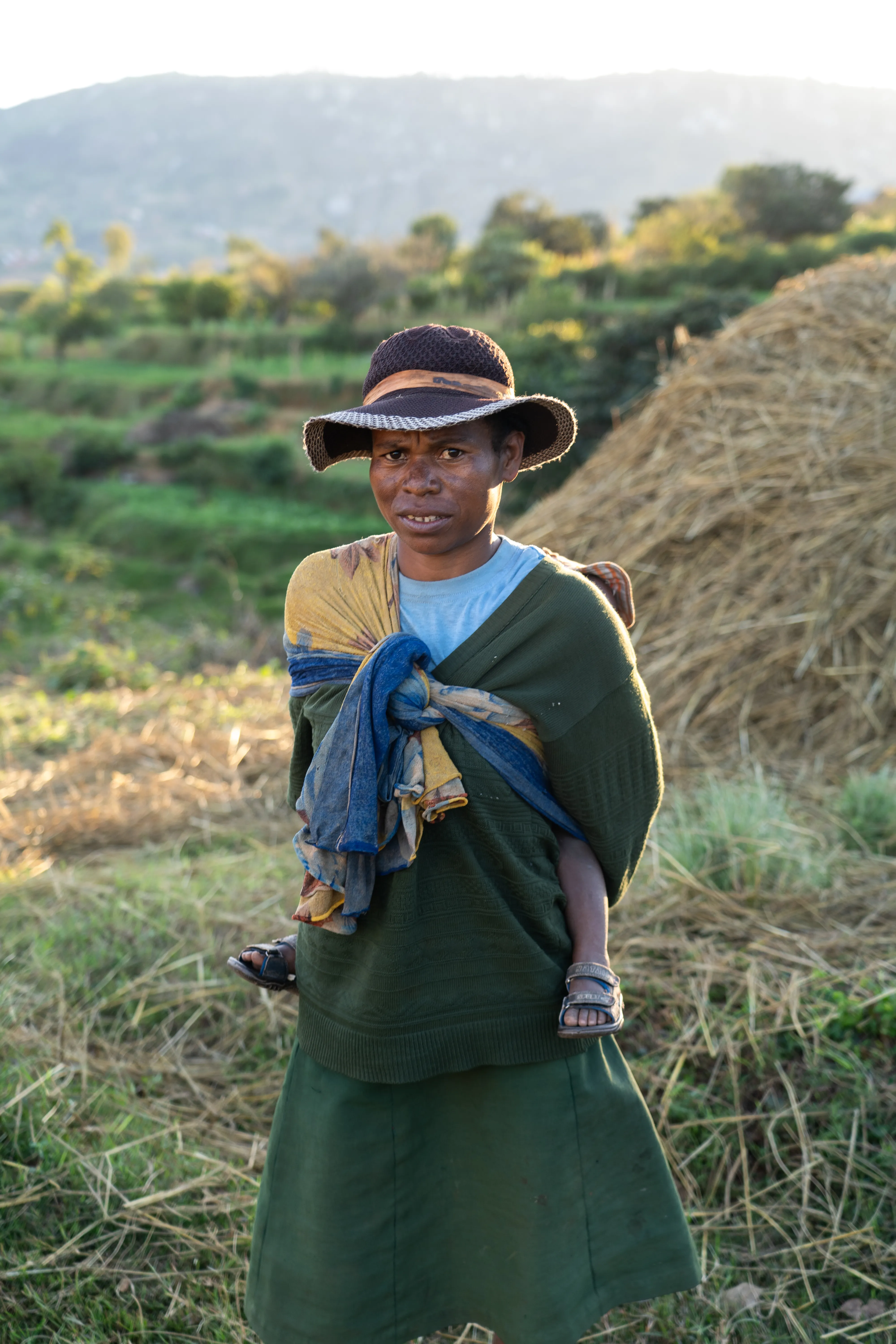 Woman carrying her child in a wrap, Madagascar