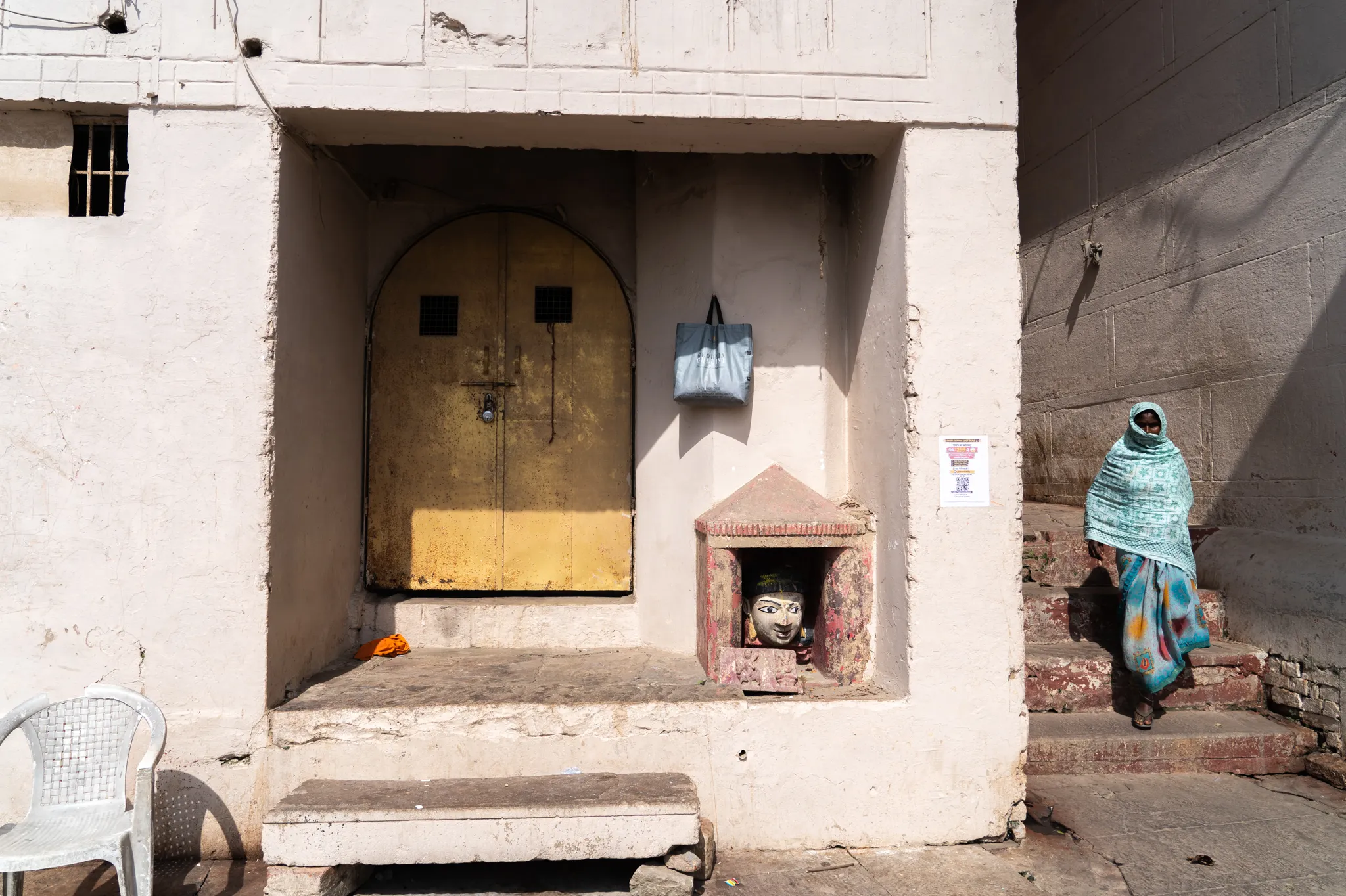 Walking past shrines in Varanasi, India
