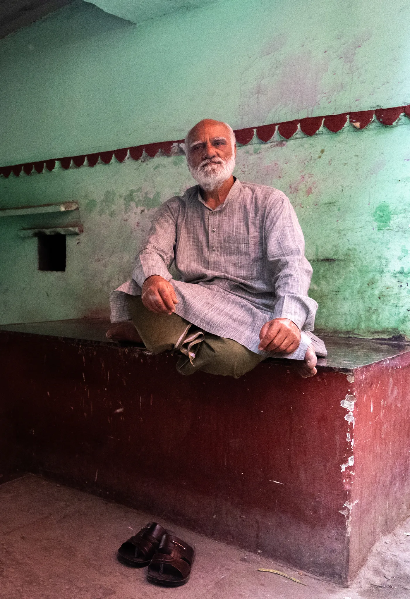 An elder relaxing in Varanasi, India