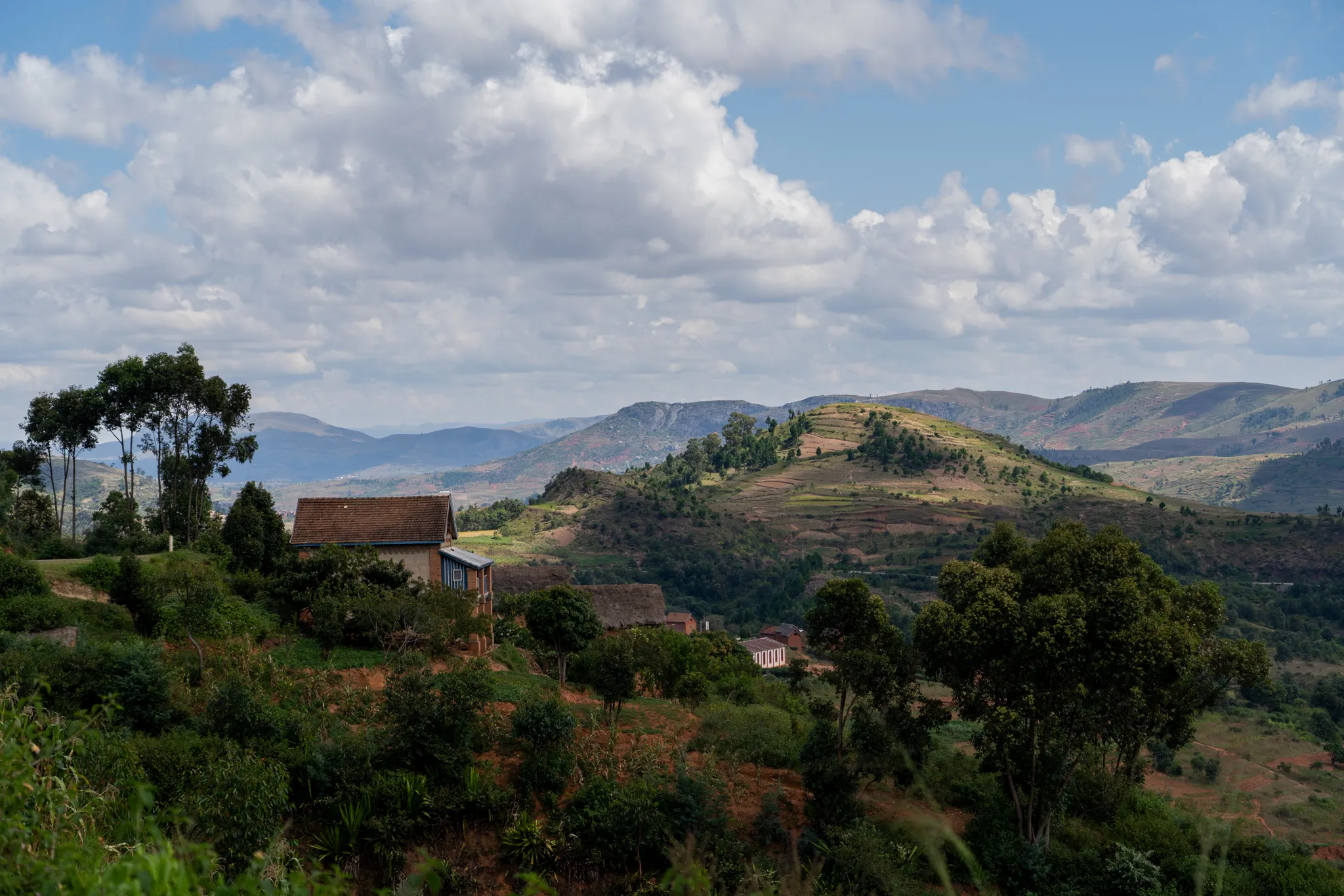 Ridge-top home overlooking layered mountains, Madagascar