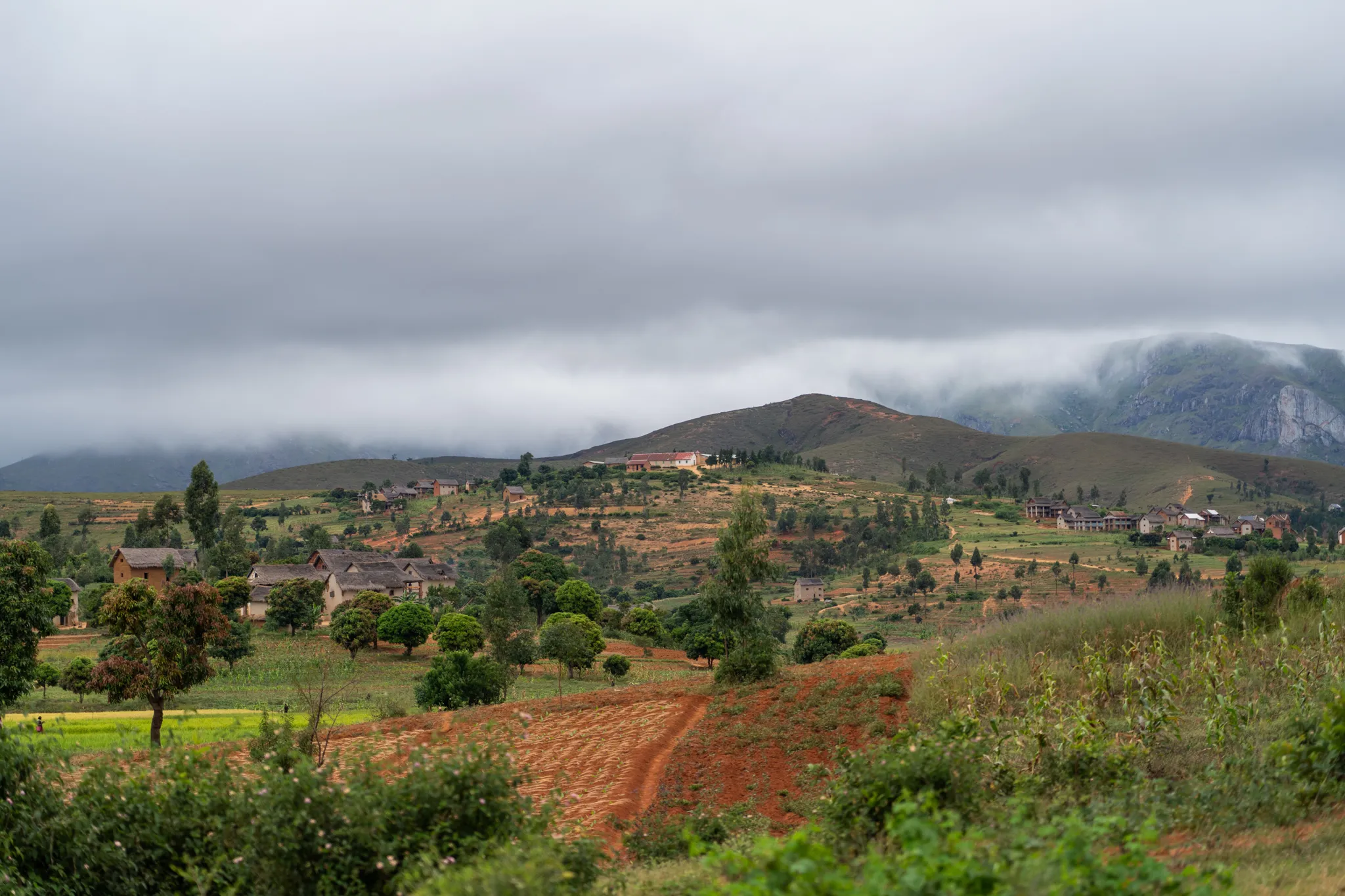 Village beneath low clouds