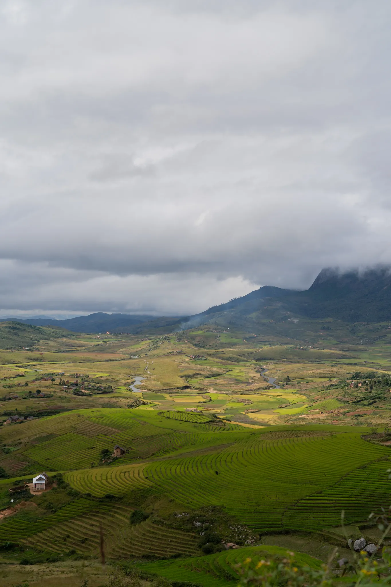 River winding through a cloud-shrouded valley, Madagascar