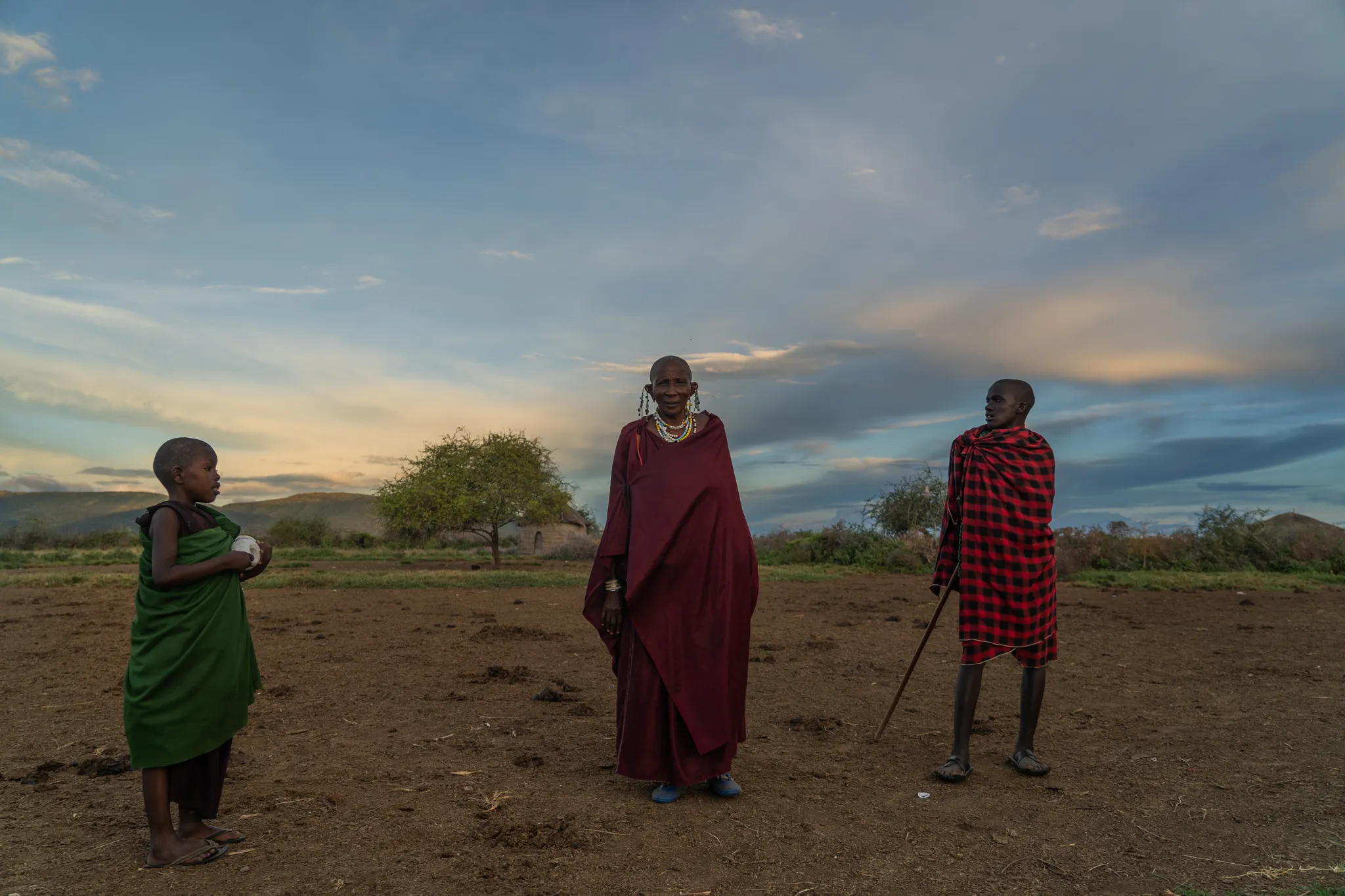 Three Massai generations at sundown, Tanzania