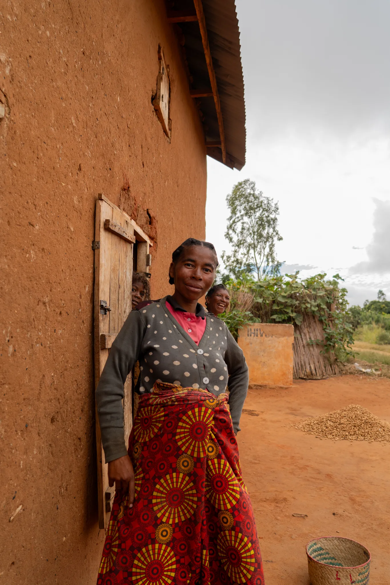 Portrait of a woman outside her home