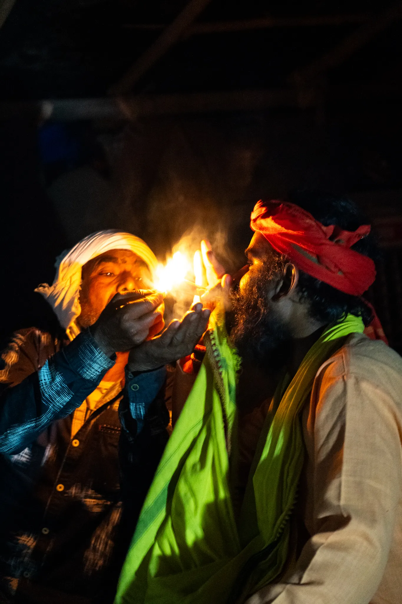 Sadhu smoking from chillum before bed near Rishikesh, India