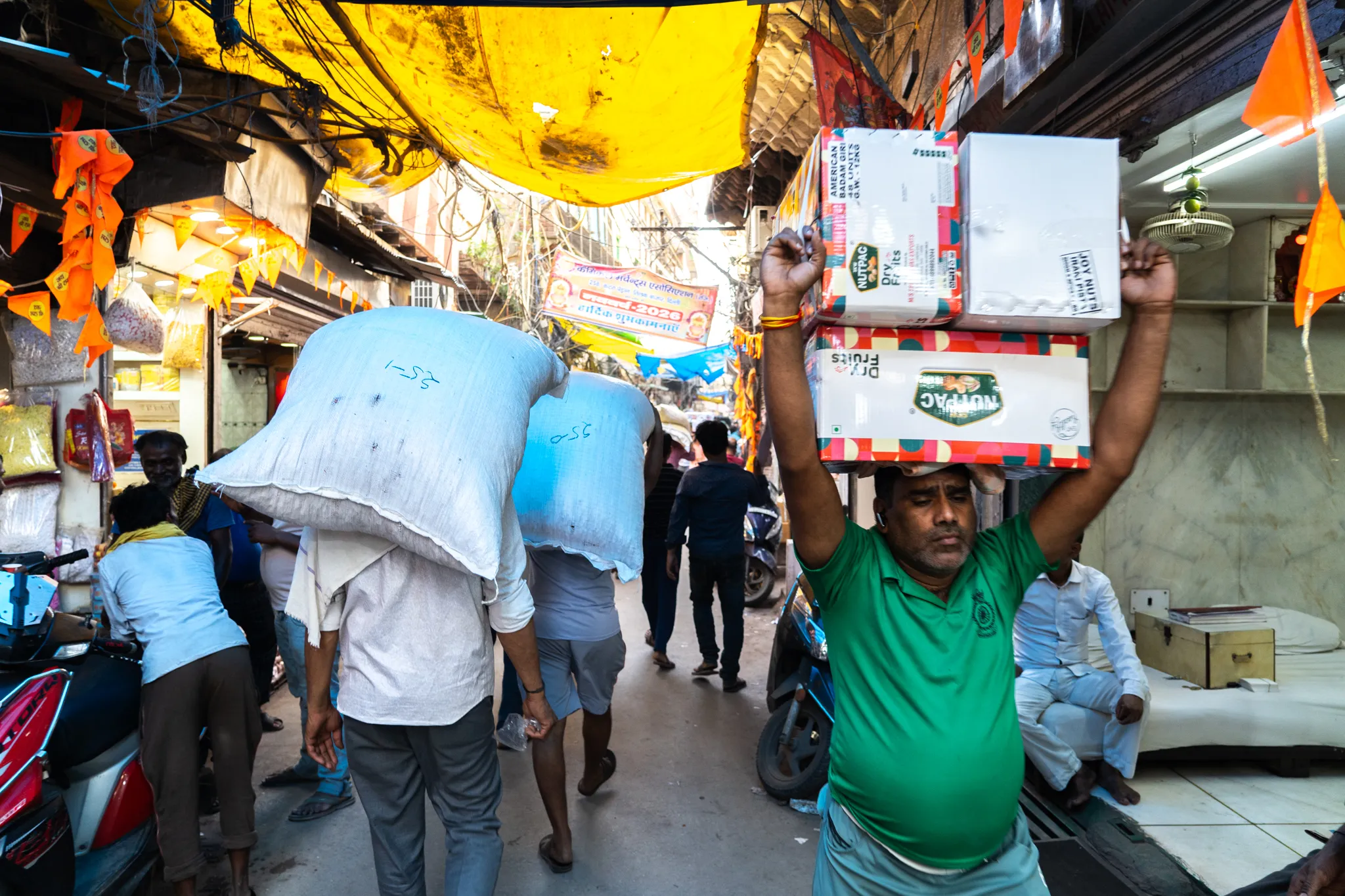 Porters hauling goods through the market