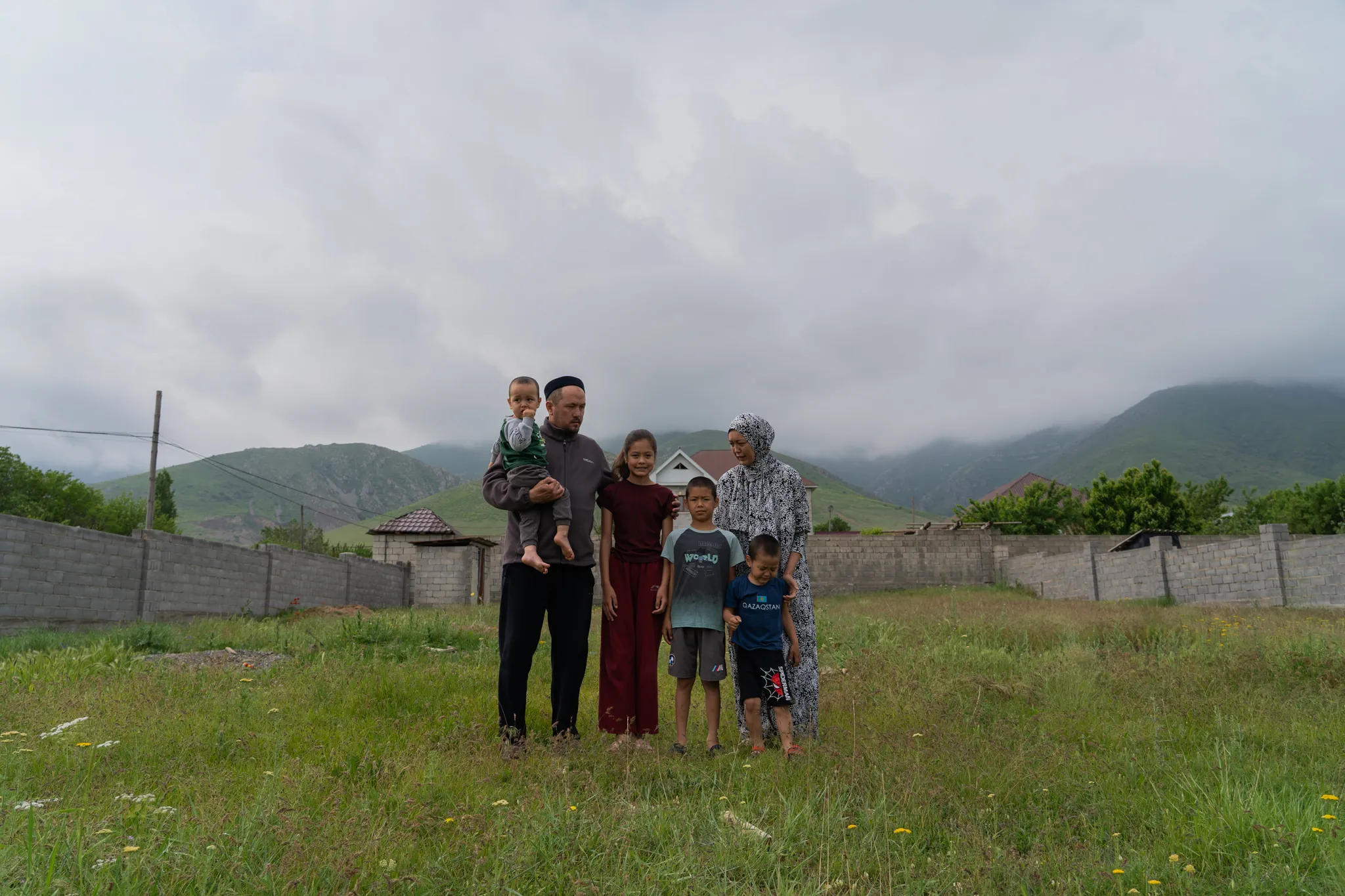 Family portrait in front of the mountains, Kazakhstan
