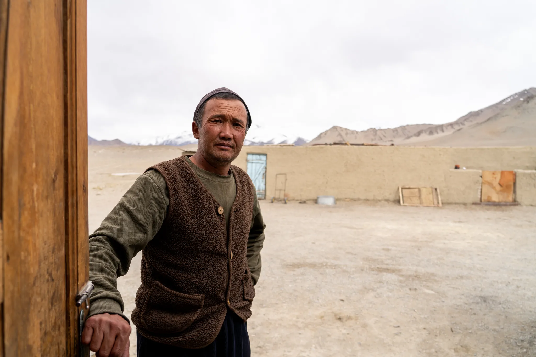 Man in the doorway of his home, Tajikistan