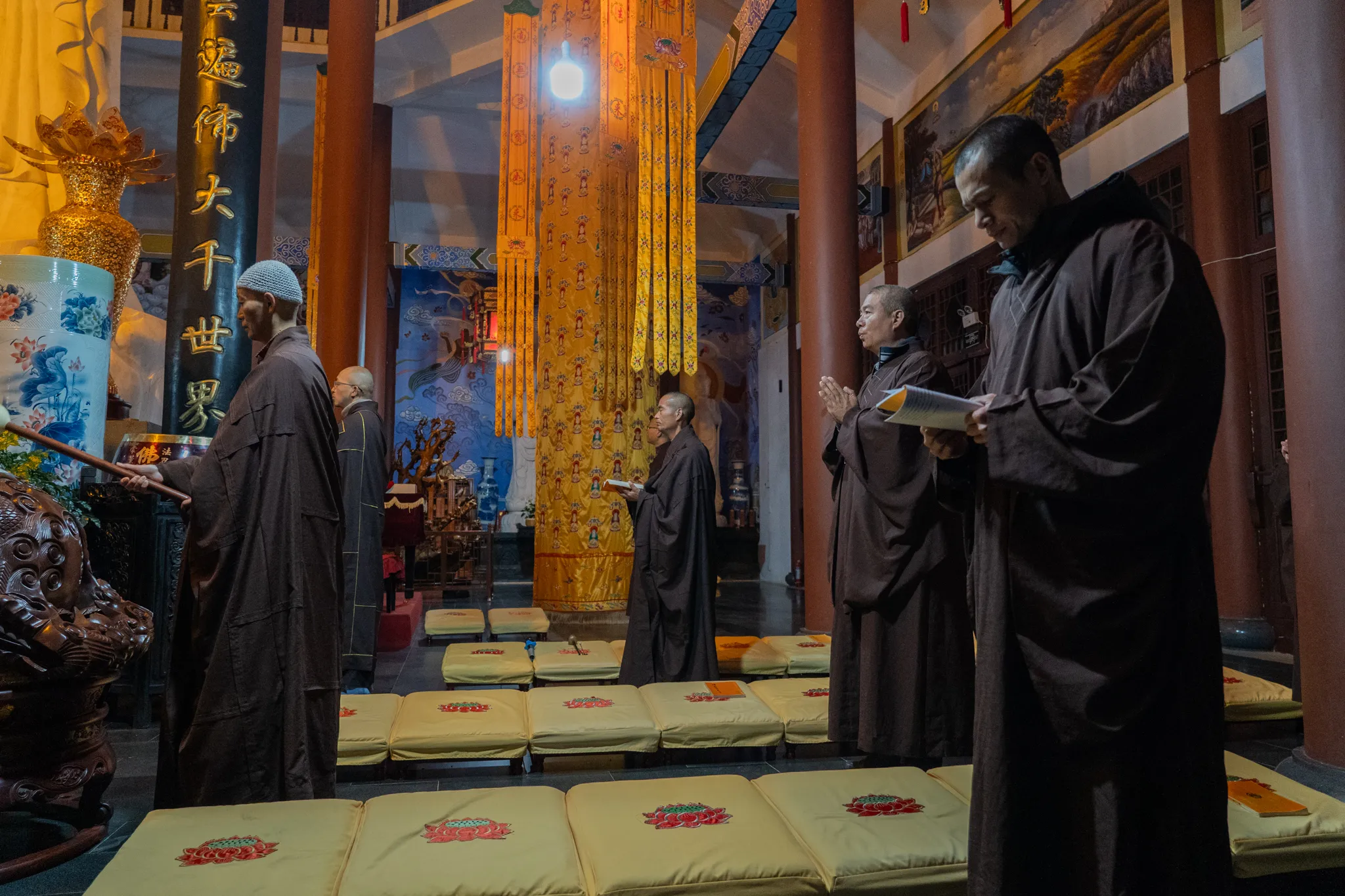 Monks chanting in a temple hall